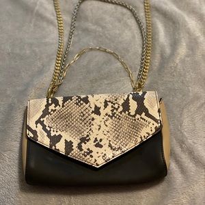 Snake print purse with silver and gold chains